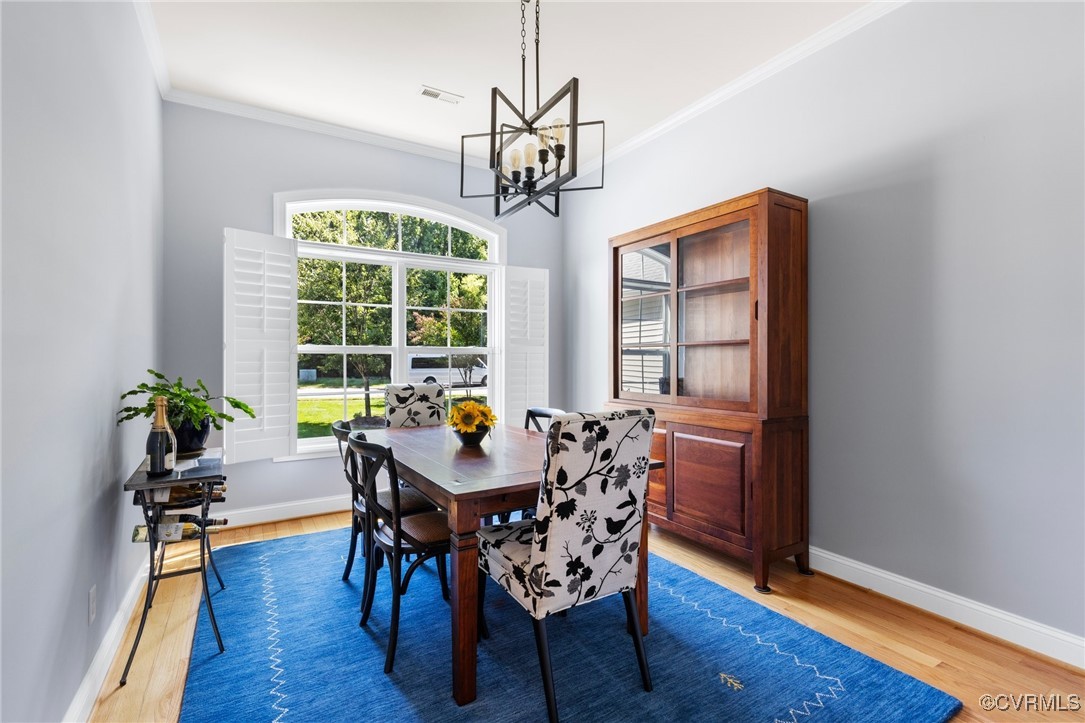 14619 Forest Row Trail Midlothian, VA 23112 - Photo 6 of 43 a view of a dining room with furniture window and wooden floor