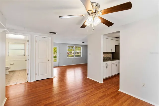 a view of a livingroom with wooden floor
