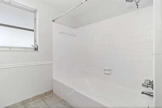 a view of a house with backyard and porch