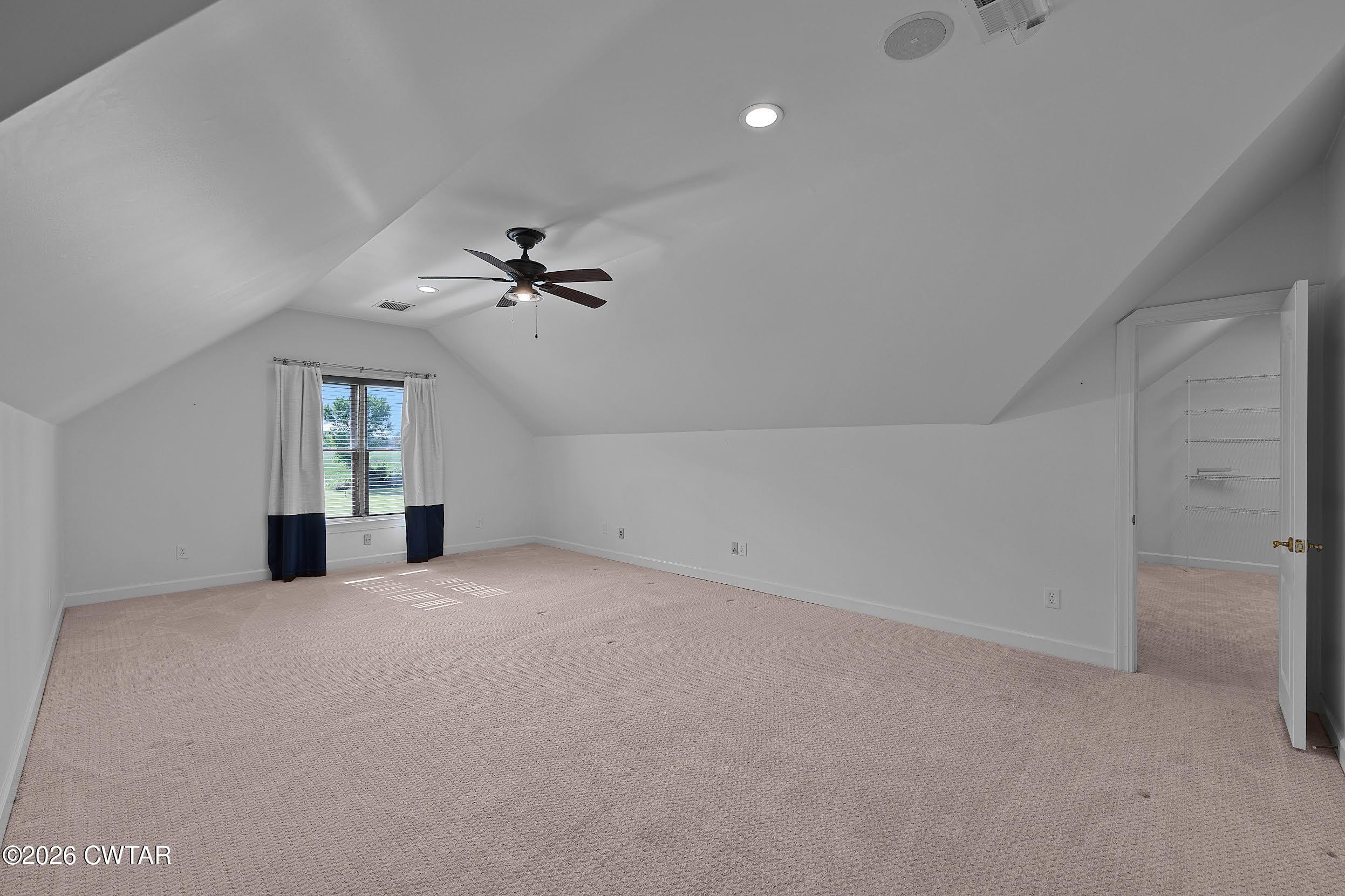 58 Huntington Place Jackson, TN 38305 - Photo 28 of 38 an empty room with chandelier fan and windows