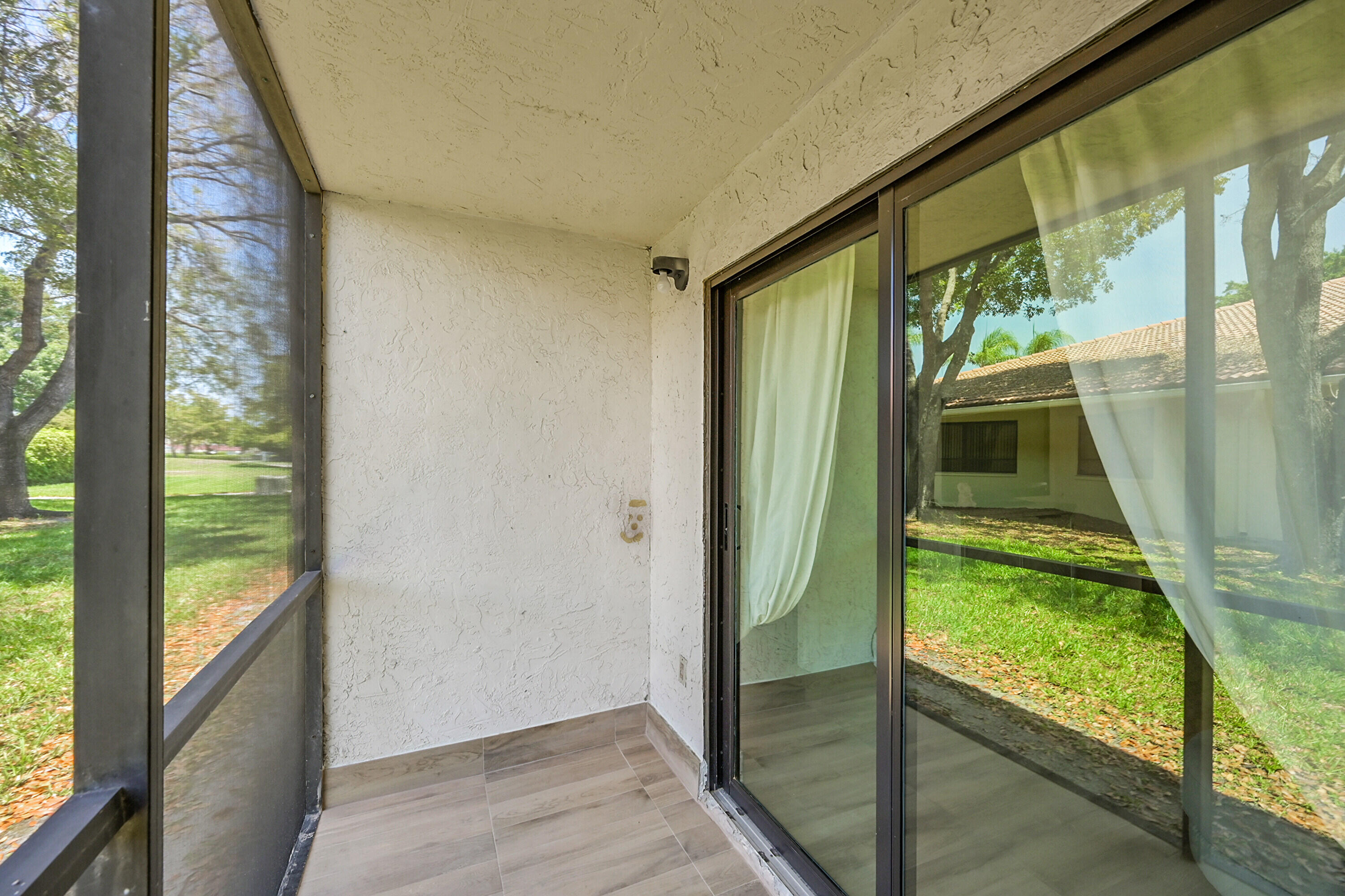 9503 Boca Cove Circle, Unit 603 Boca Raton, FL 33428 - Photo 23 of 30 23_sun room