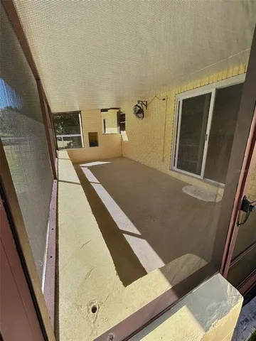 a view of swimming pool with trees and outdoor seating