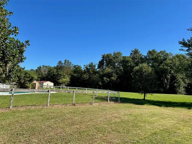 a view of a golf course with a lake