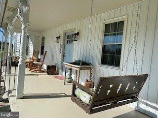 3161 Apple Pie Ridge Road Winchester, VA 22603 - Photo 3 of 39 Concrete front porch pad with porch lattice work