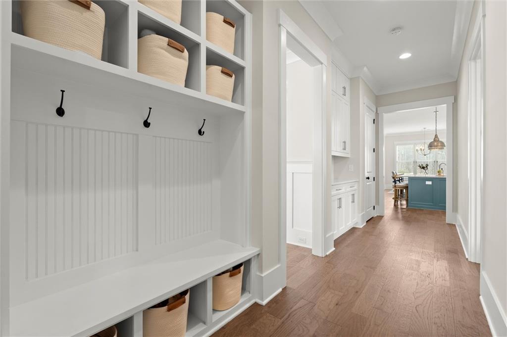 3809 Cochran Lake Road Marietta, GA 30062 - Photo 20 of 40 a view of a hallway with wooden floor and a bathroom