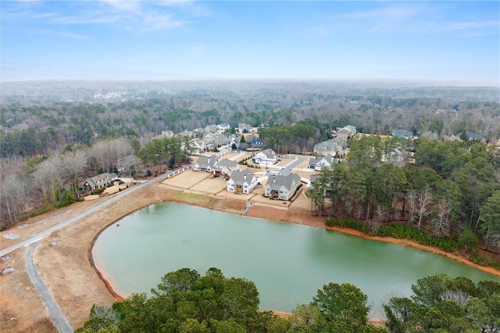 3809 Cochran Lake Road Marietta, GA 30062 - Photo 2 of 40 an aerial view of a house with a garden and lake view