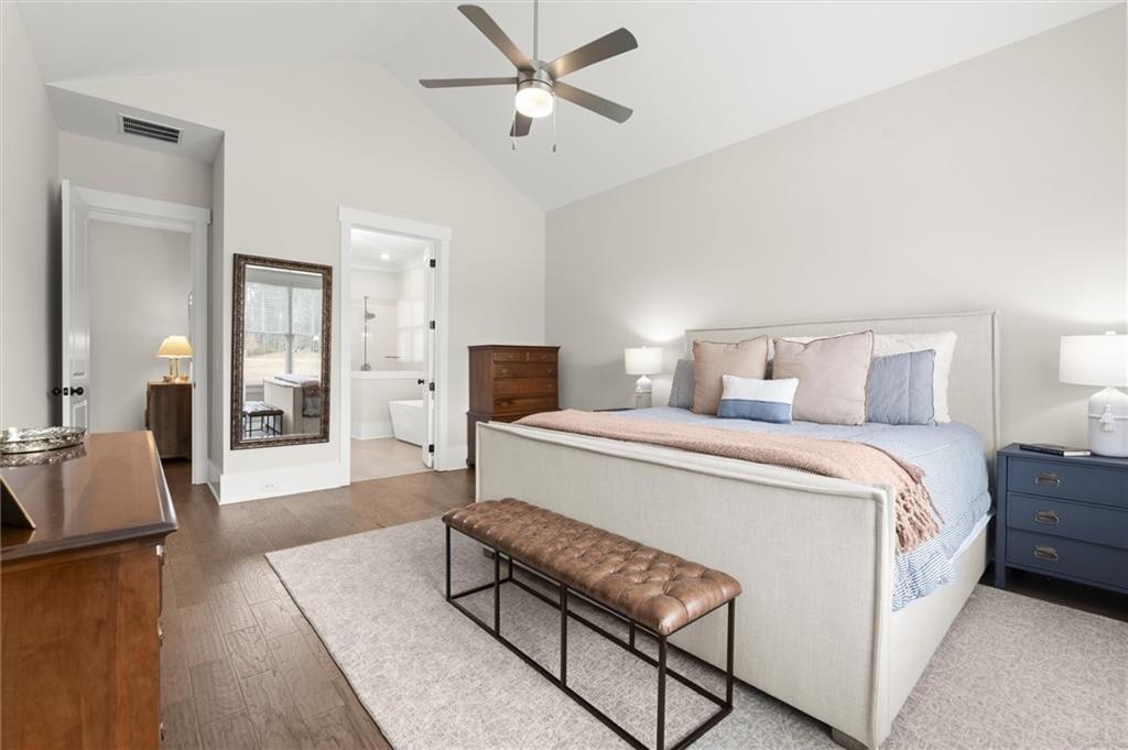 3809 Cochran Lake Road Marietta, GA 30062 - Photo 22 of 40 a spacious bedroom with a bed and couch