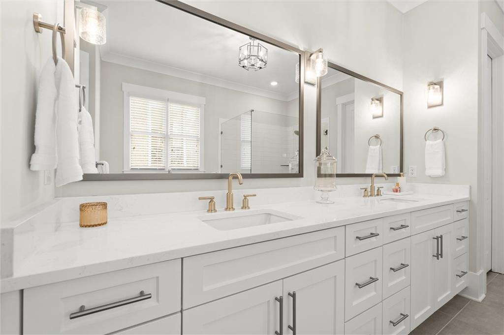 3809 Cochran Lake Road Marietta, GA 30062 - Photo 23 of 40 a bathroom with a sink and a mirror