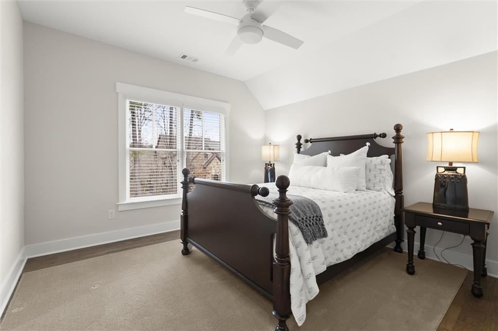 3809 Cochran Lake Road Marietta, GA 30062 - Photo 29 of 40 a bedroom with a bed chair and window
