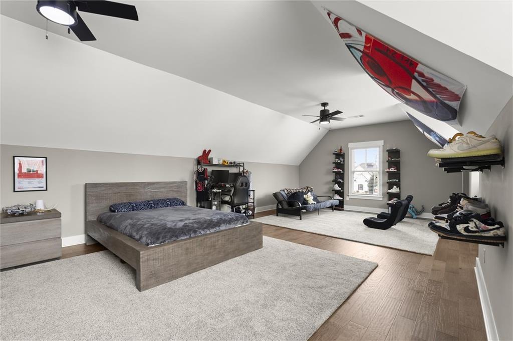 3809 Cochran Lake Road Marietta, GA 30062 - Photo 35 of 40 a bedroom with furniture and a bed