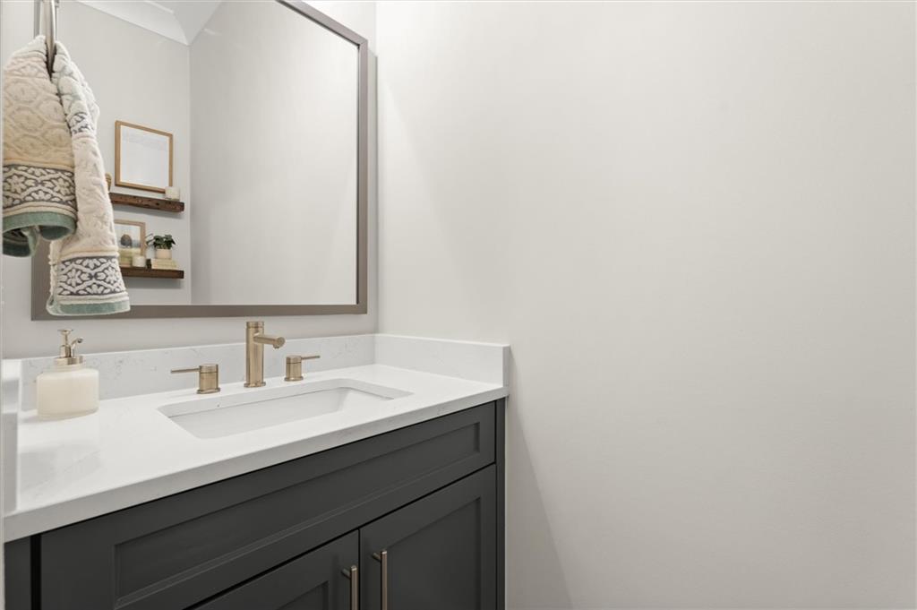 3809 Cochran Lake Road Marietta, GA 30062 - Photo 37 of 40 a bathroom with a sink and a mirror