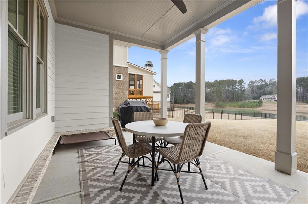 3809 Cochran Lake Road Marietta, GA 30062 - Photo 39 of 40 a view of a patio with a table and chairs