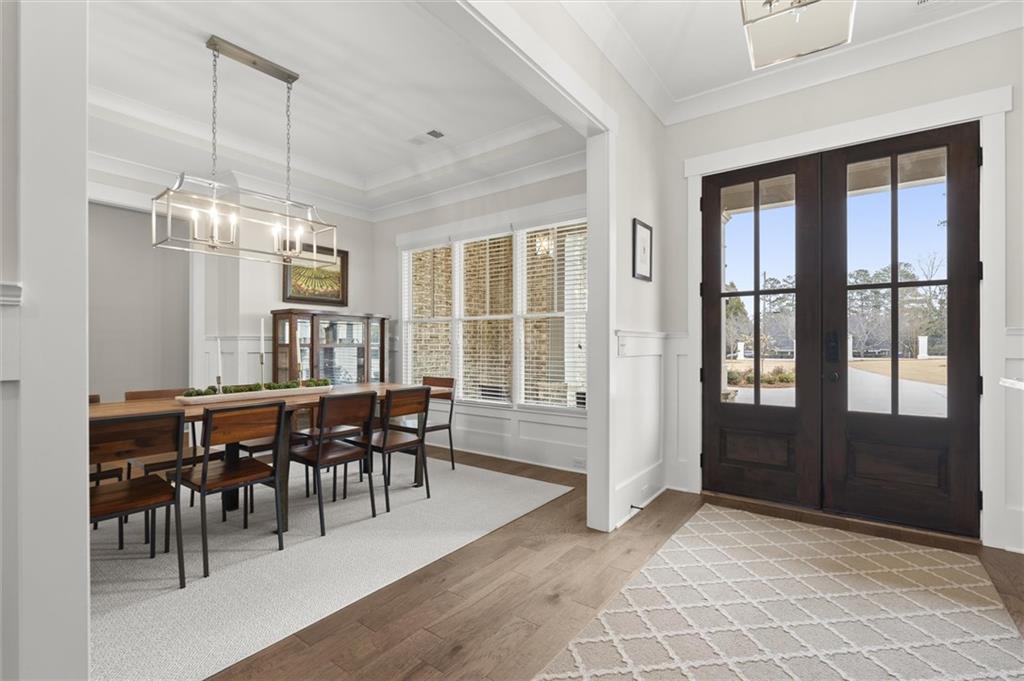 3809 Cochran Lake Road Marietta, GA 30062 - Photo 6 of 40 a view of a dining room with furniture window and wooden floor