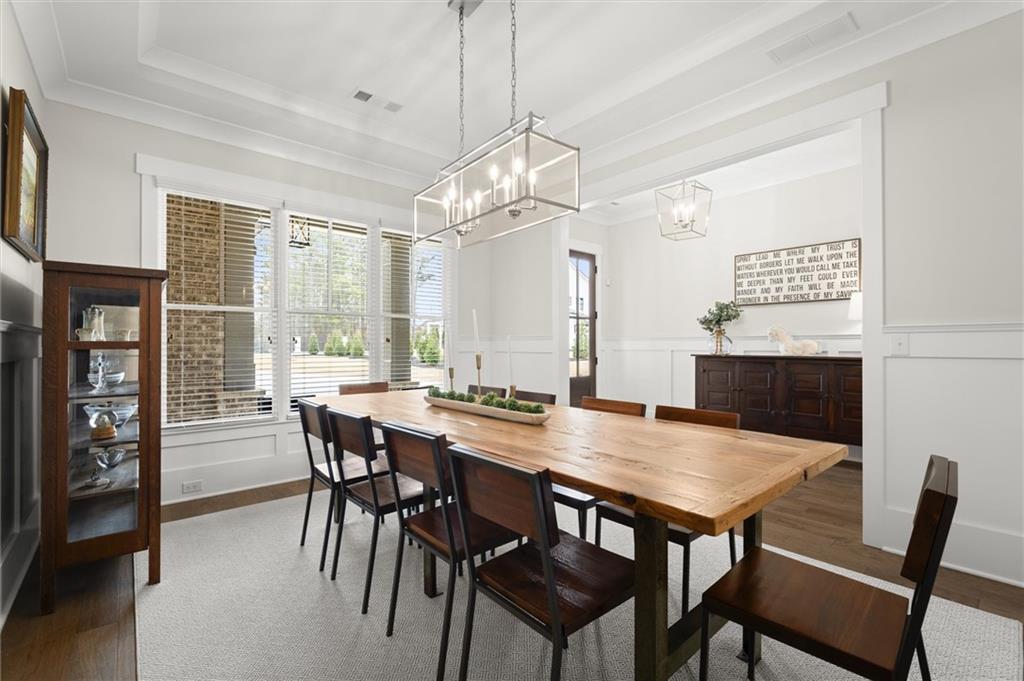 3809 Cochran Lake Road Marietta, GA 30062 - Photo 8 of 40 a view of a dining table and chairs in a room
