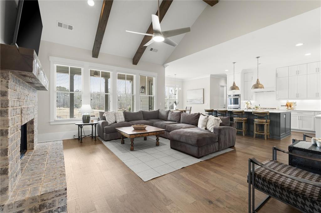 3809 Cochran Lake Road Marietta, GA 30062 - Photo 10 of 40 a living room with lots of furniture and a fireplace