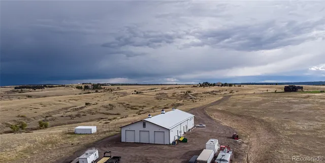 a workspace with furniture and wooden floor