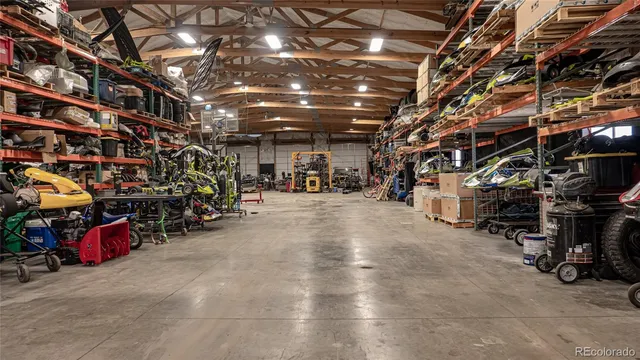 a kitchen with granite countertop a table chairs stove and cabinets