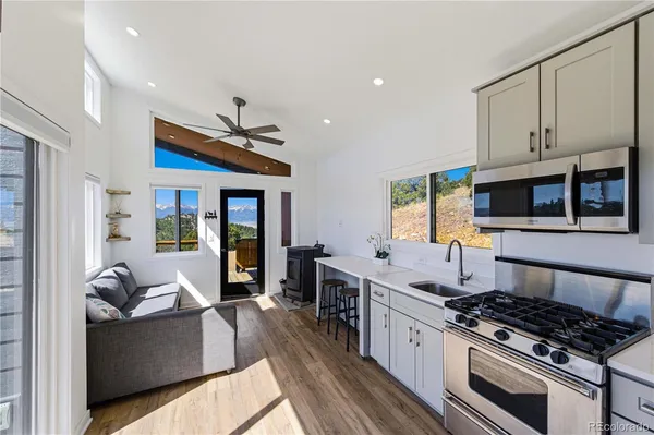 a kitchen with stainless steel appliances granite countertop a stove and a sink
