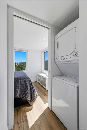 a bedroom with a bed and a mirror