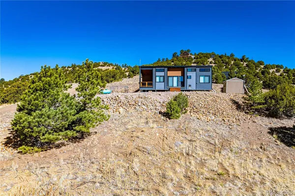 a view of a yard with a house in the background