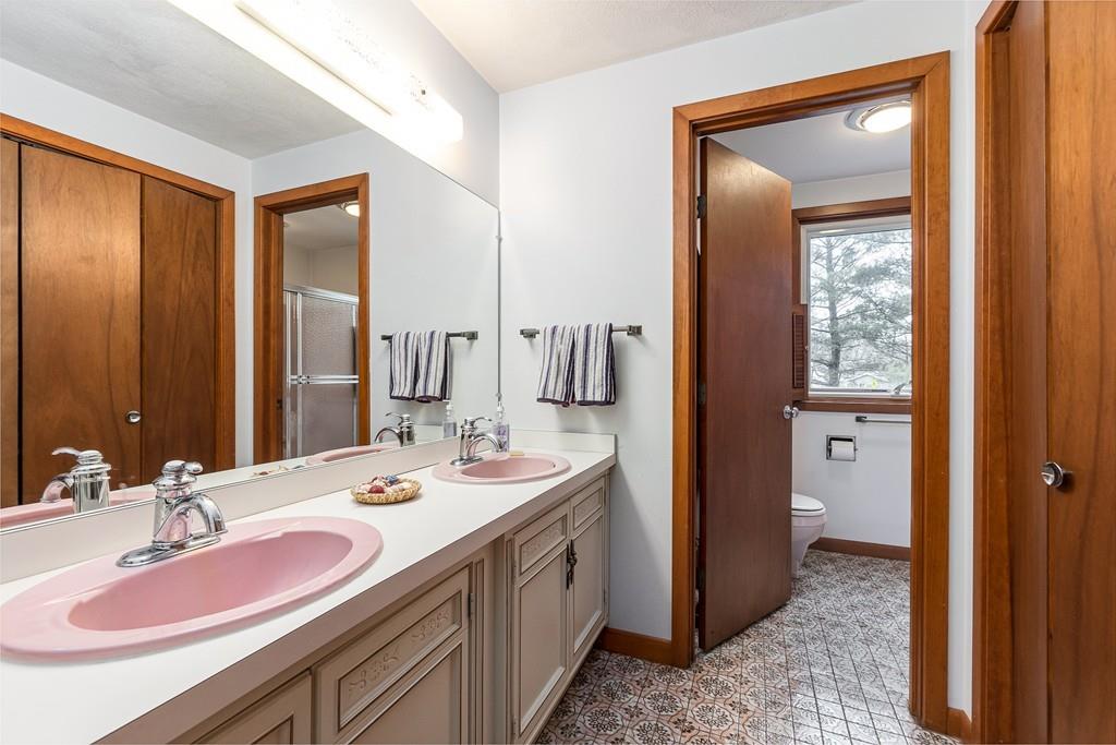 2 Ryder Lane Lexington, MA 02421 - Photo 12 of 14 a bathroom with a double vanity sink and a mirror