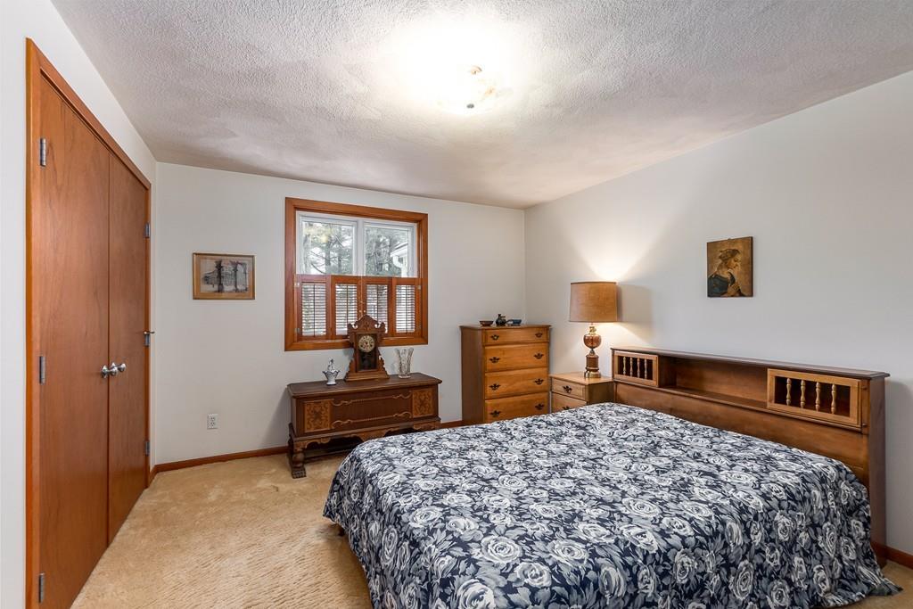 2 Ryder Lane Lexington, MA 02421 - Photo 10 of 14 a bedroom with a bed and dresser with chair