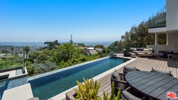 a view of balcony with furniture