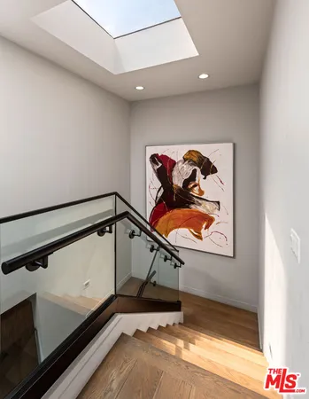 a spacious bedroom with a large bed and a fireplace