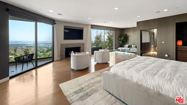 a view of a balcony with an outdoor seating