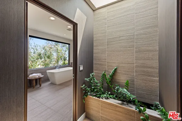 a bathroom with a bathtub and a sink