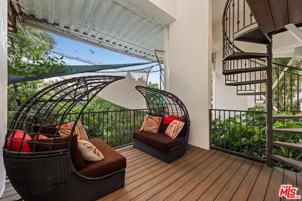 a backyard of a building with lots of green space