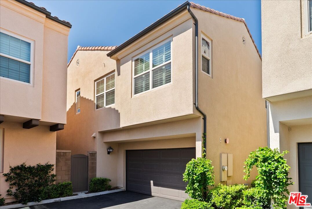 119 Excursion Irvine, CA 92618 - Photo 1 of 2 a front view of a house with plants and entryway