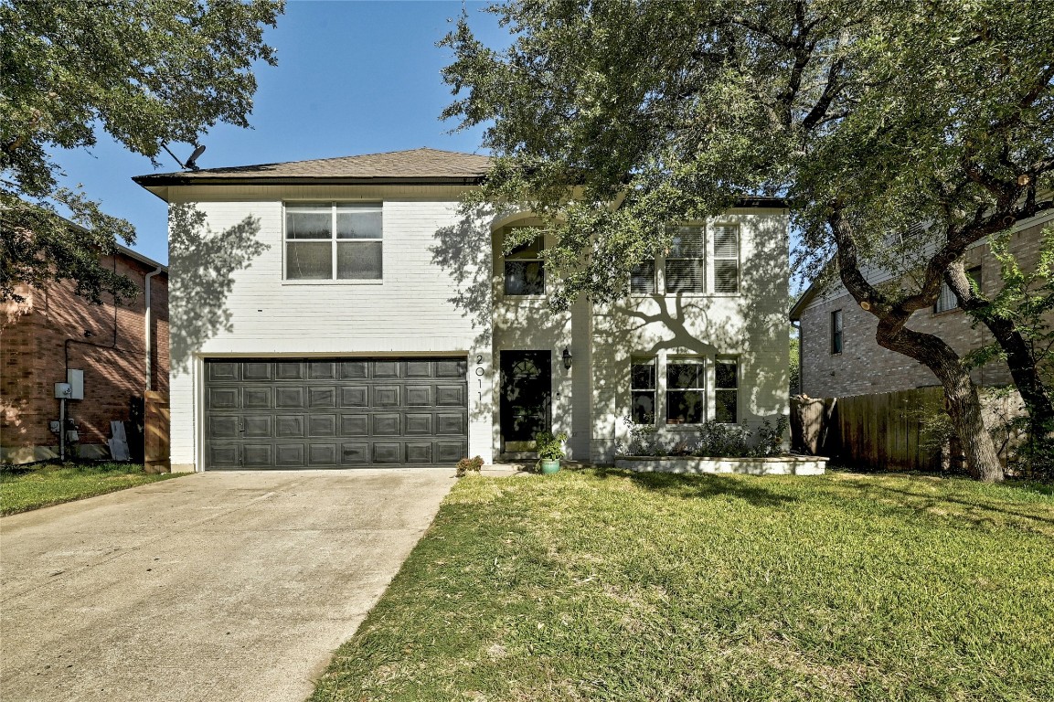 2011 Rachel Ridge Cedar Park, TX 78613 - Photo 1 of 1 a front view of a house with a yard