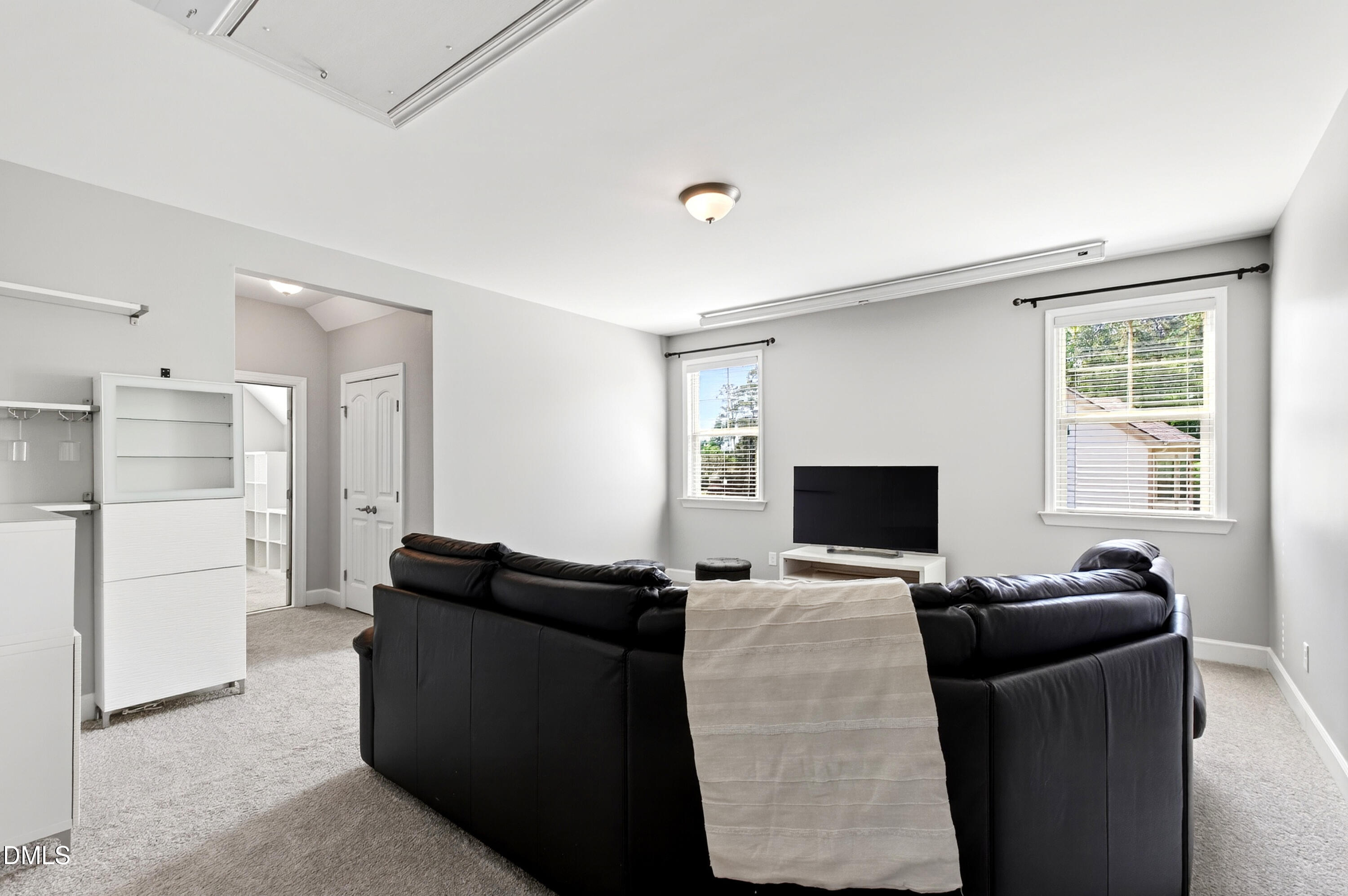 313 Karpen Lane Cary, NC 27519 - Photo 55 of 86 a view of a livingroom with furniture and a flat screen tv