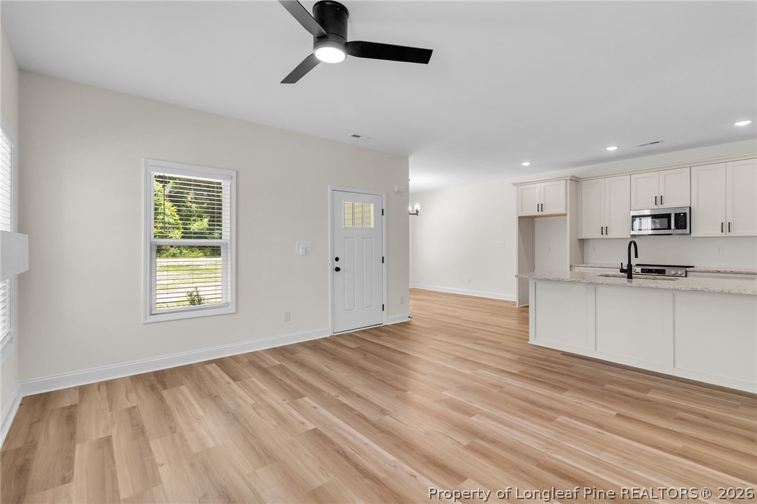 131 Merle Road Pinebluff, NC 28373 - Photo 10 of 33 a view of an empty room with kitchen appliances and a window