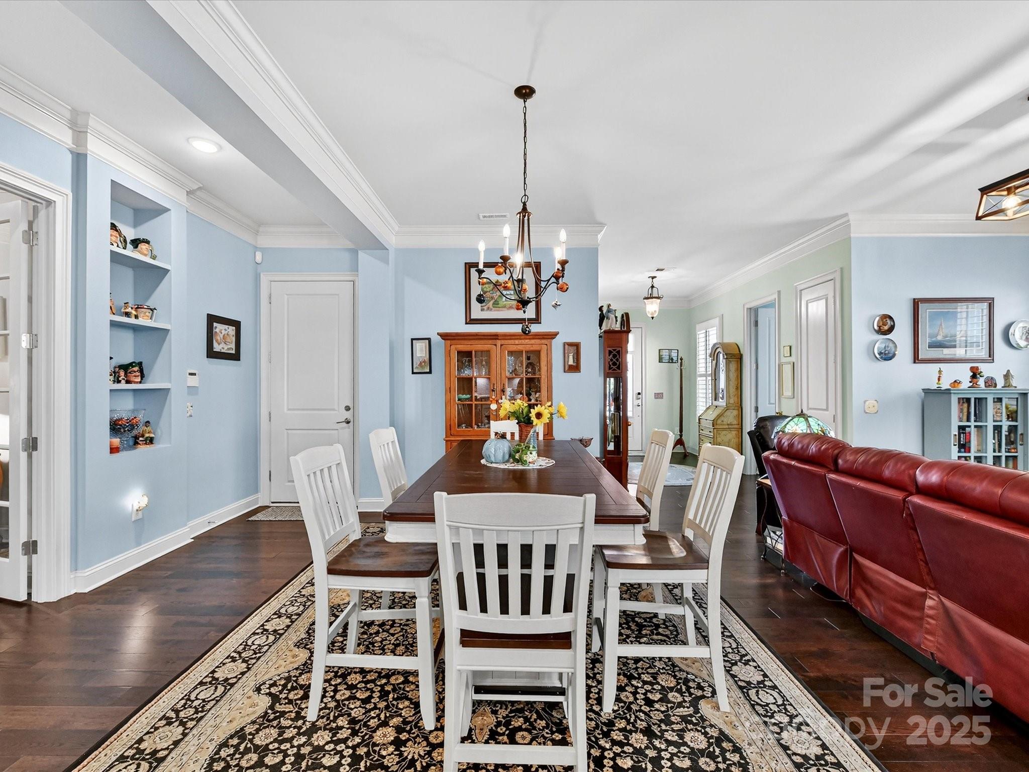 2006 Laney Pond Road Matthews, NC 28104 - Photo 12 of 30 a view of a dining room with furniture wooden floor and a chandelier