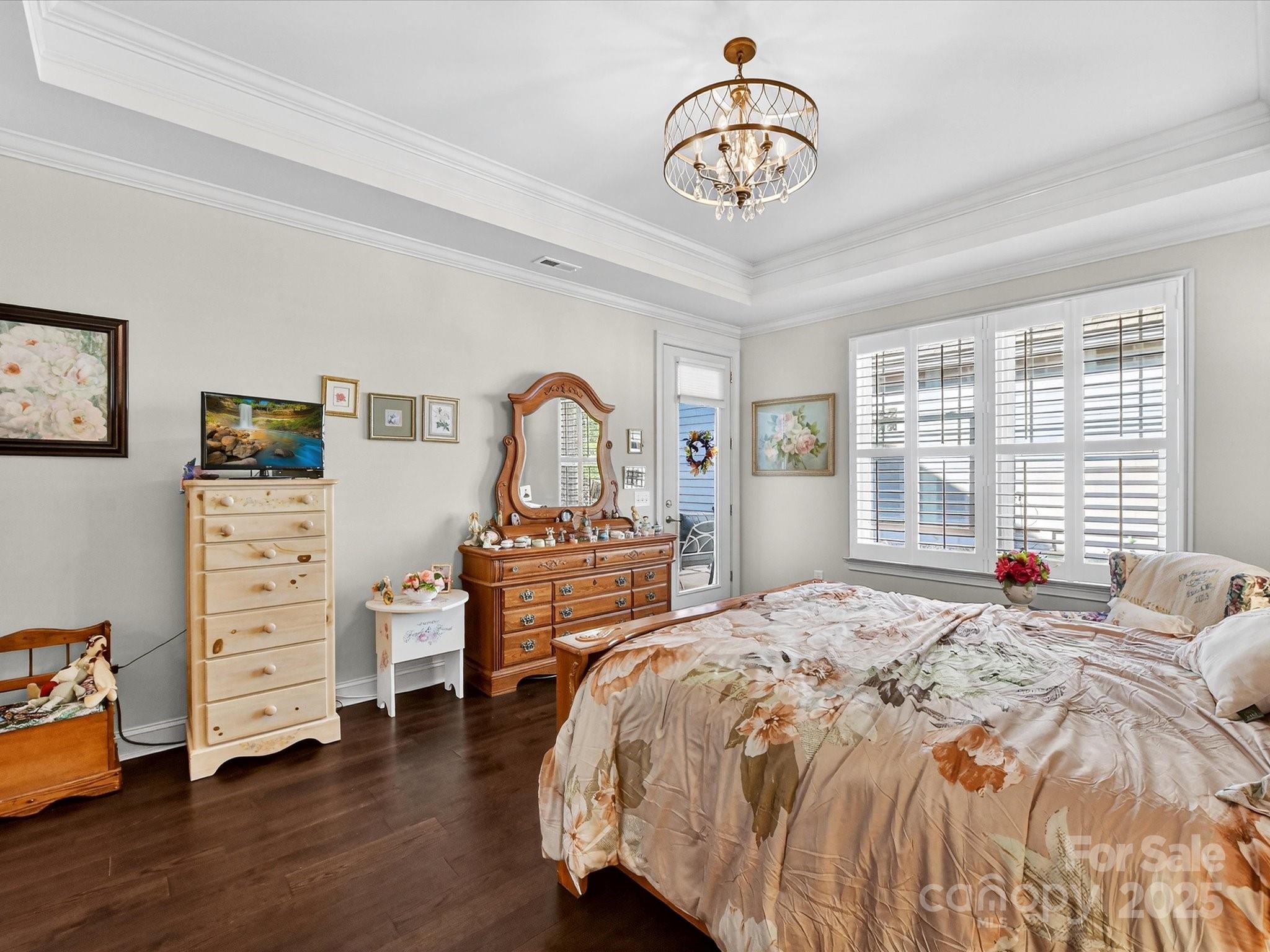 2006 Laney Pond Road Matthews, NC 28104 - Photo 16 of 30 a bedroom with bed and wooden floor