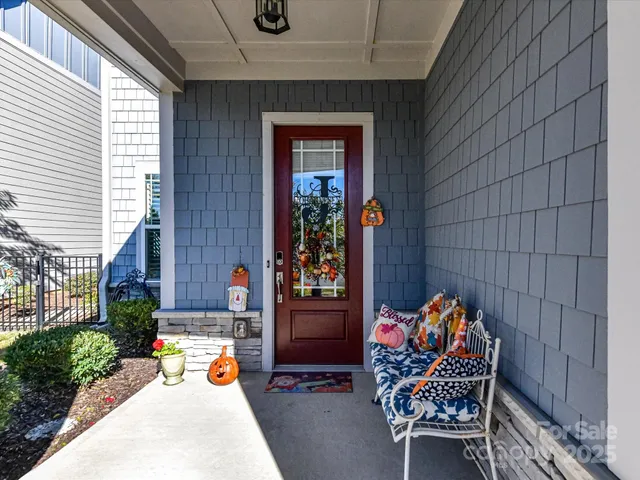 an outdoor view of a house with outdoor seating