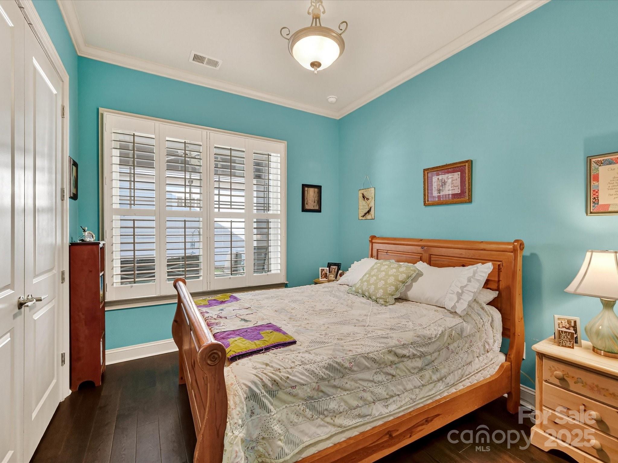 2006 Laney Pond Road Matthews, NC 28104 - Photo 22 of 30 a bed sitting in a bedroom next to a window