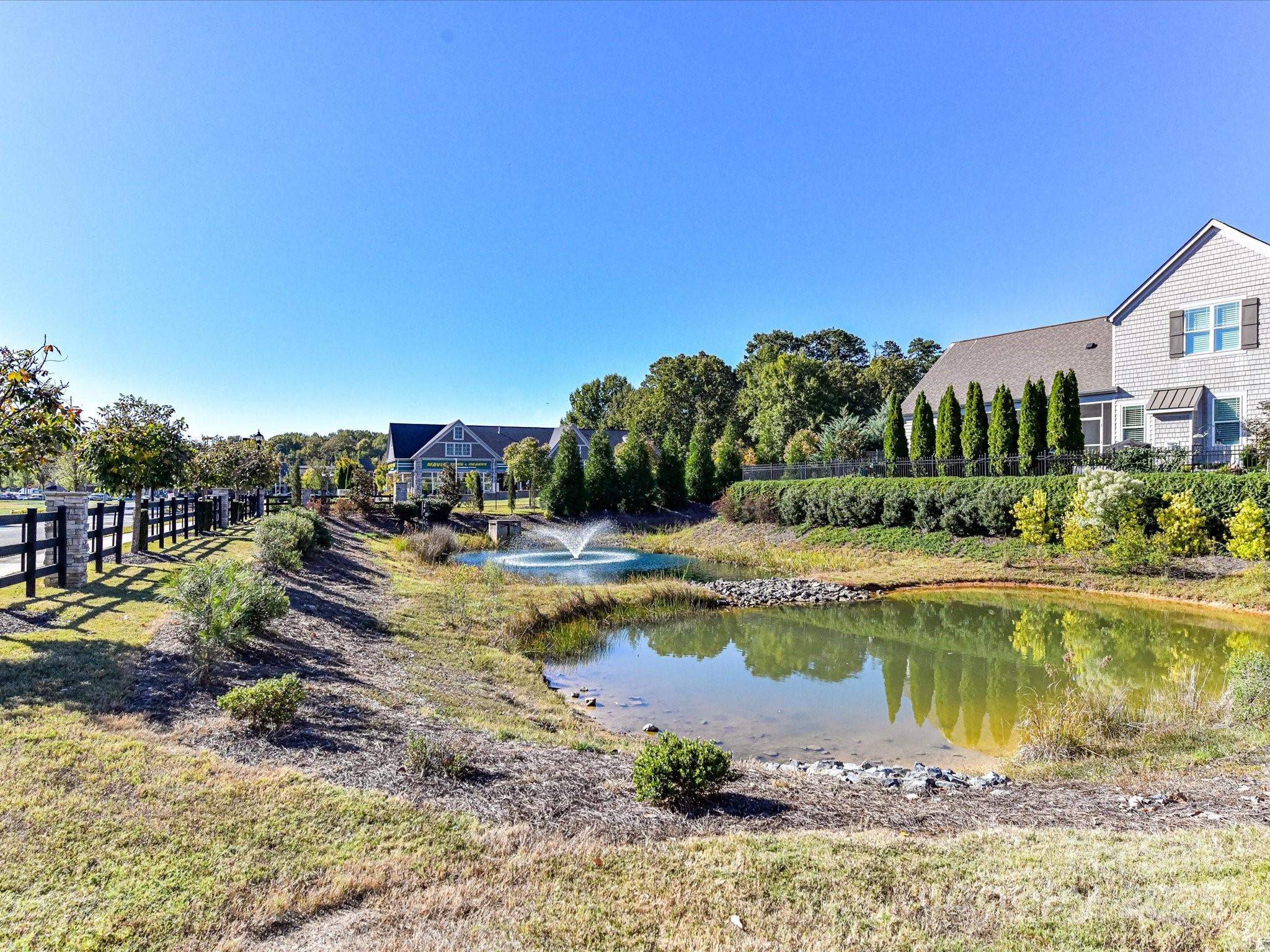 2006 Laney Pond Road Matthews, NC 28104 - Photo 30 of 30 a view of a lake with a house swimming pool and outdoor space