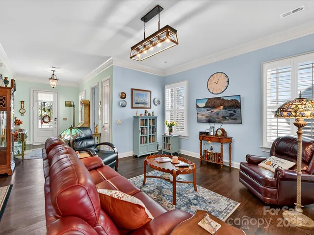 a living room with furniture and a table