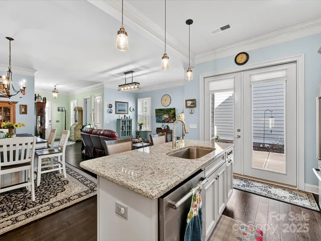 a kitchen with sink and refrigerator
