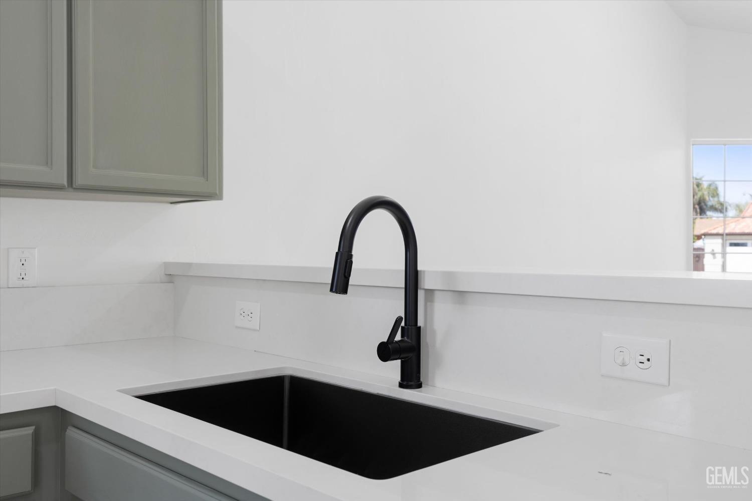 Undisclosed Address Bakersfield, CA 93306 - Photo 15 of 32 a close view of a sink and dishwasher with kitchen island