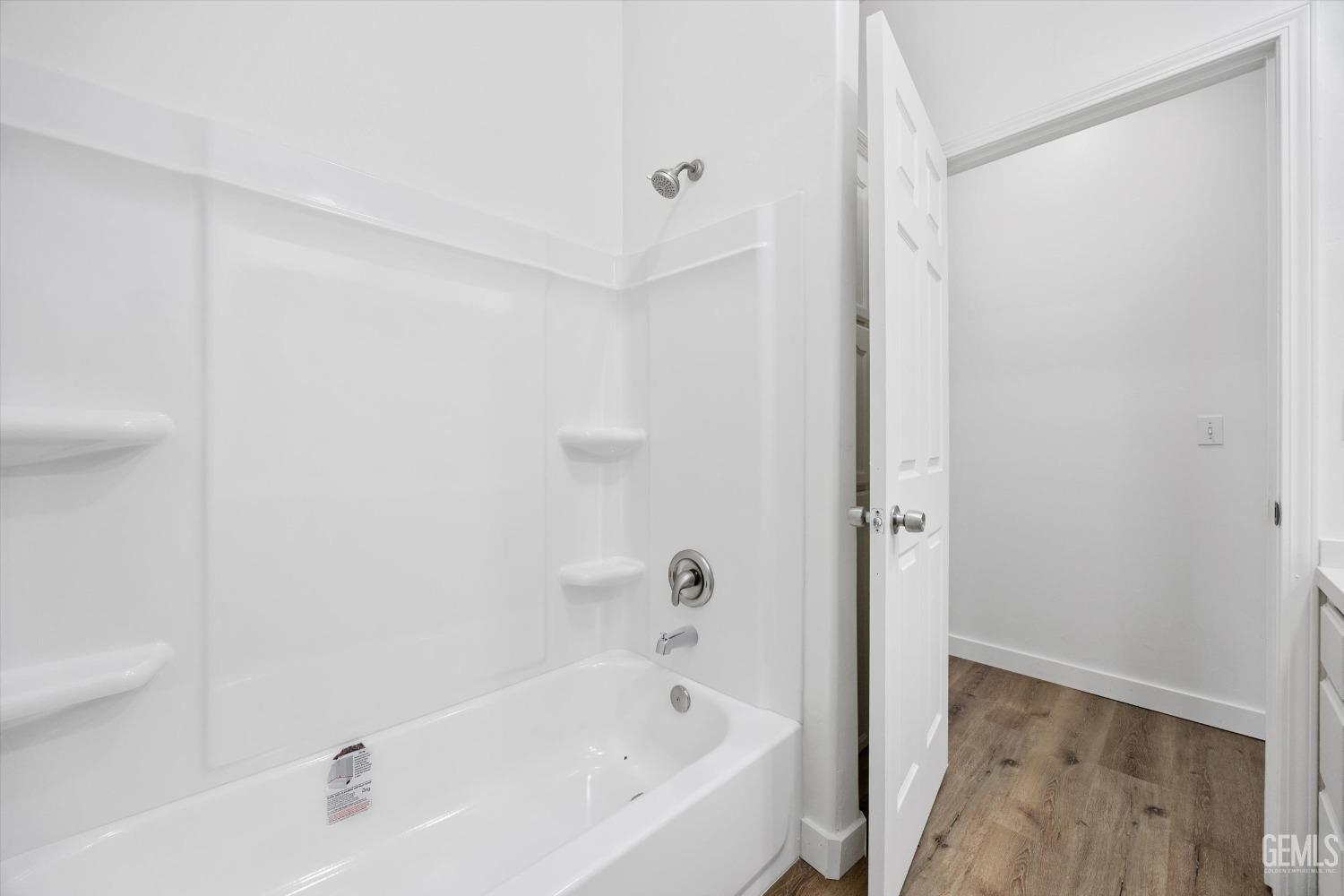 Undisclosed Address Bakersfield, CA 93306 - Photo 24 of 32 a white bath tub sitting next to a white sink and vanity