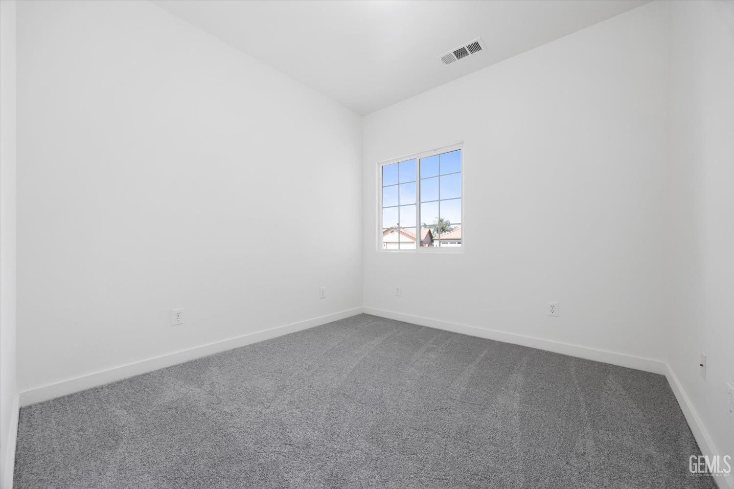 Undisclosed Address Bakersfield, CA 93306 - Photo 27 of 32 a view of an empty room and a window
