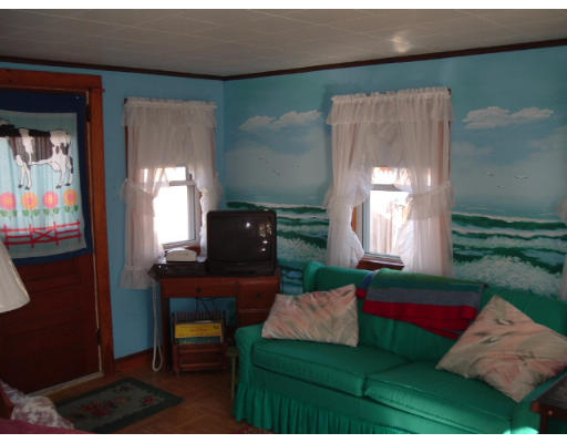 8 R Galavotti Avenue Wareham, MA 02571 - Photo 7 of 8 a living room with furniture and a gate