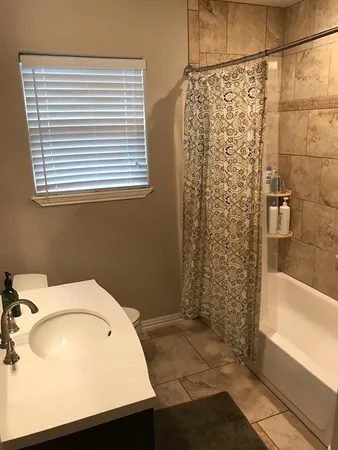 a bathroom with a sink and a shower