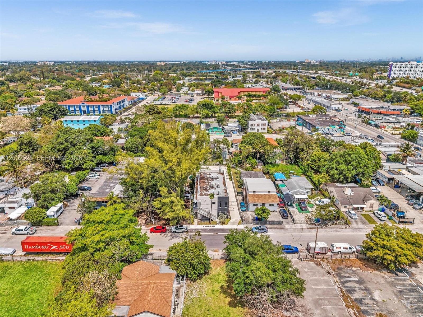753 Northwest 30th Street, Unit 3 Miami, FL 33127 - Photo 31 of 35 an aerial view of residential building with outdoor space and ocean view
