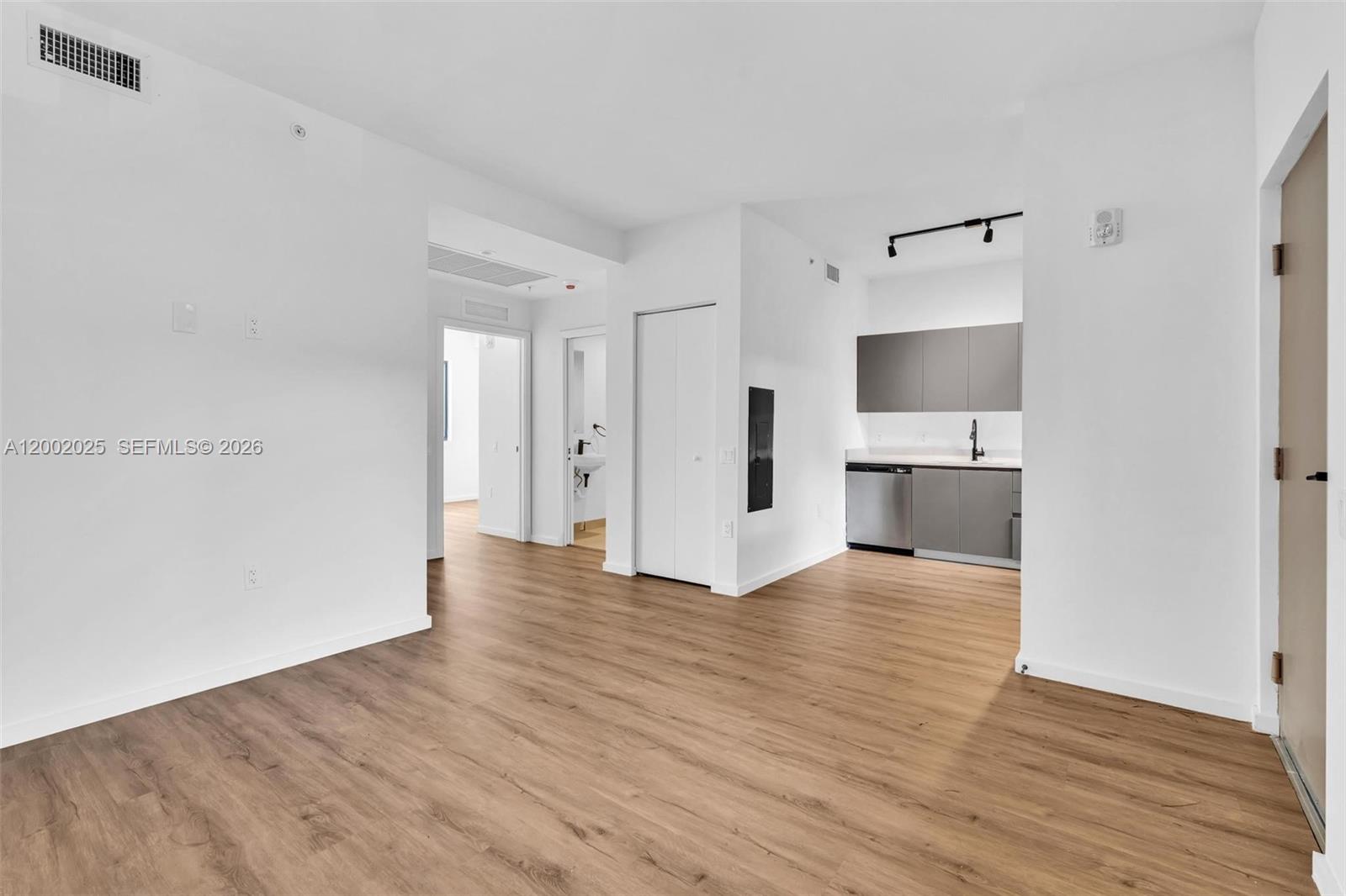 753 Northwest 30th Street, Unit 3 Miami, FL 33127 - Photo 4 of 35 a view of empty room with wooden floor