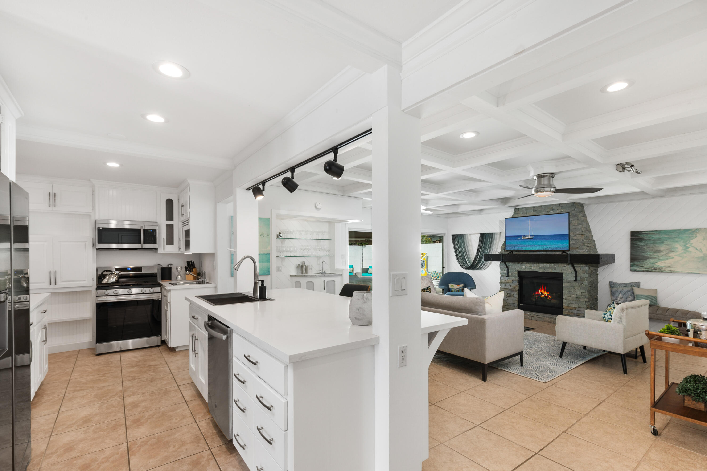70050 Chappel Road Rancho Mirage, CA 92270 - Photo 13 of 36 a large white kitchen with stainless steel appliances